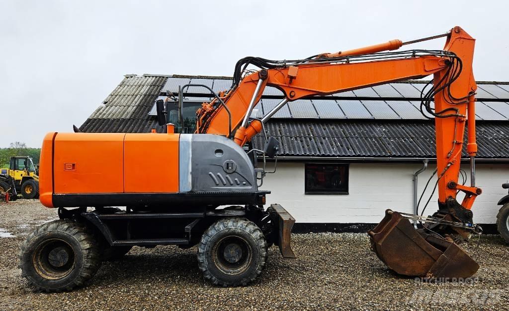Hitachi ZX 140 W-3 حفارات بعجل
