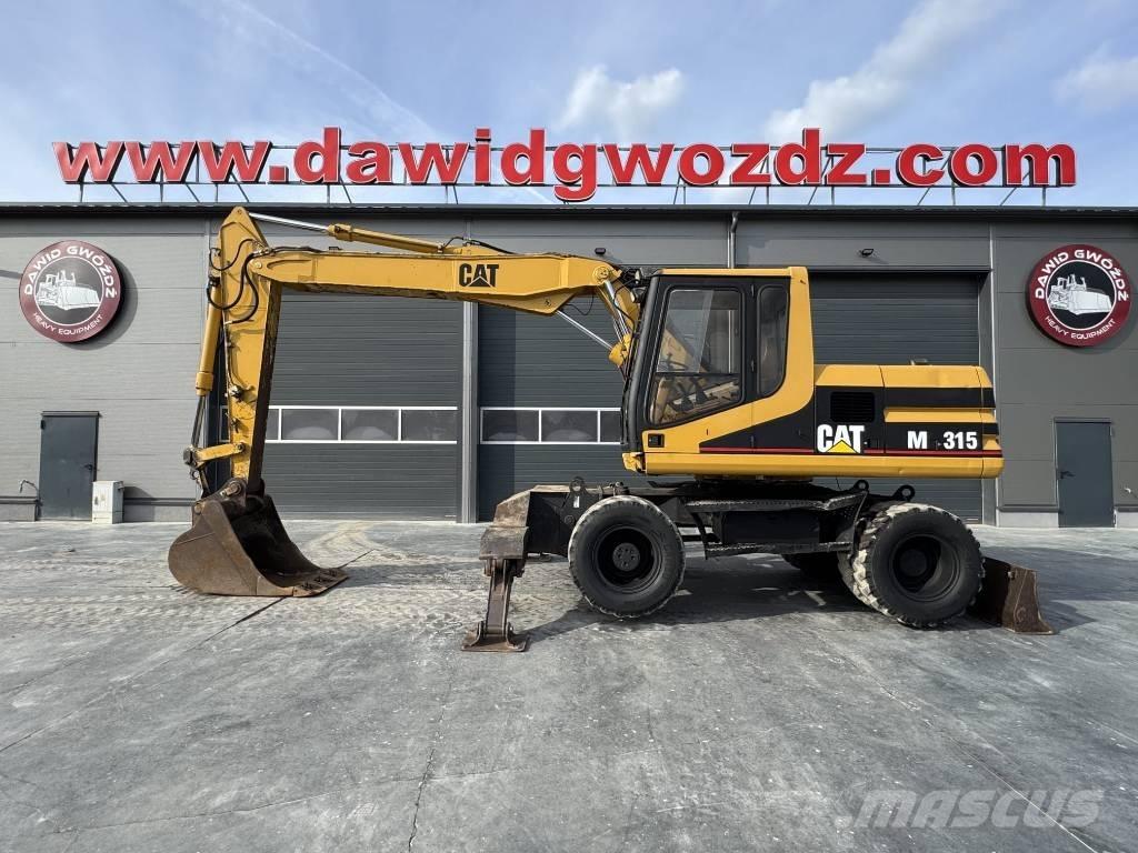 CAT M 315 حفارات بعجل