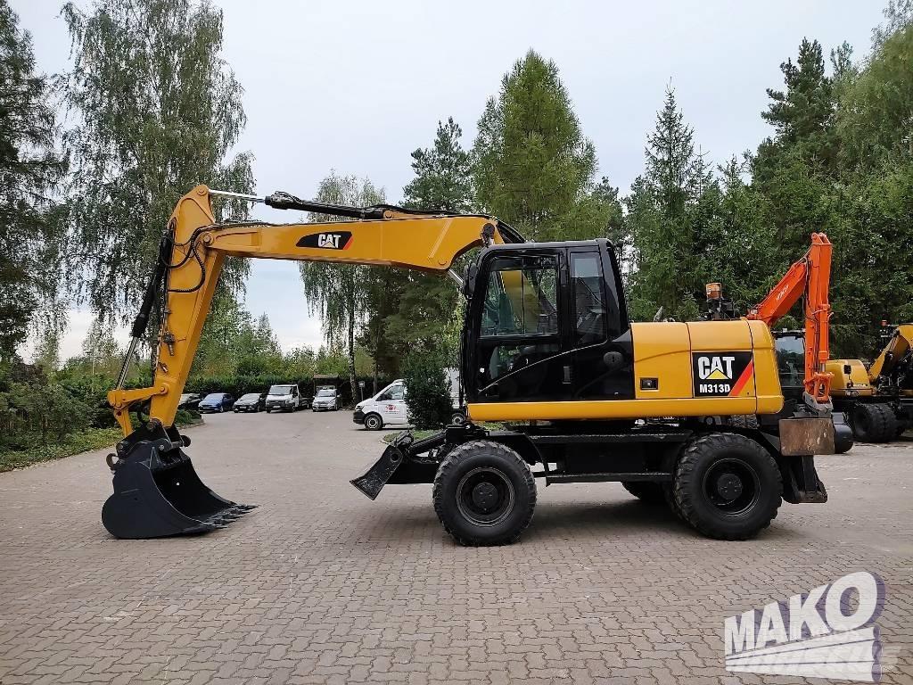 CAT M 313 D حفارات بعجل
