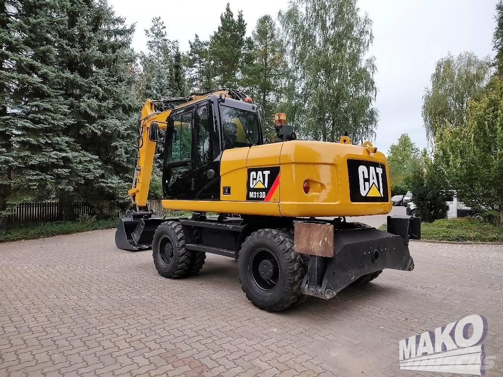 CAT M 313 D حفارات بعجل