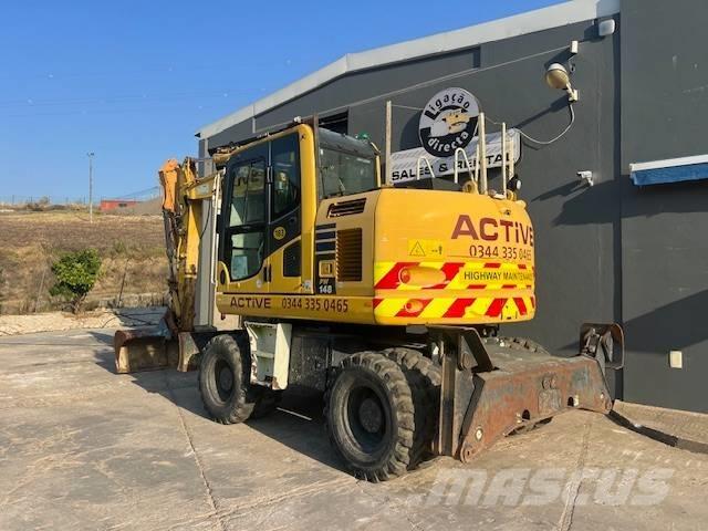 Komatsu PW 148 حفارات بعجل