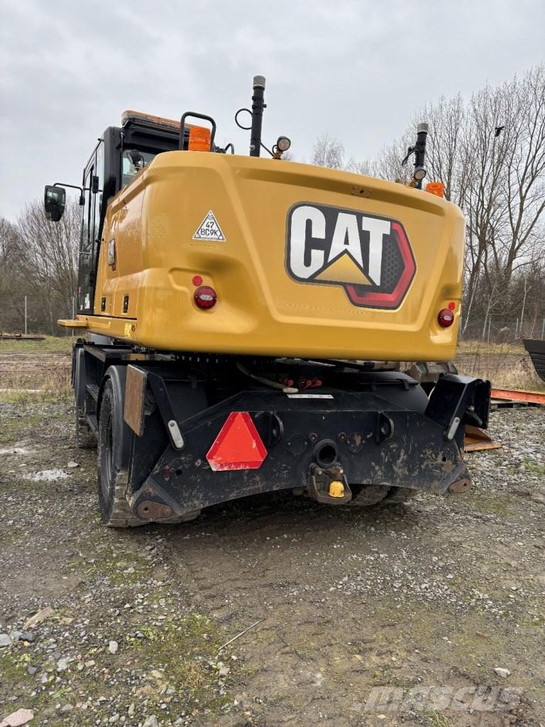 CAT M 318 حفارات بعجل