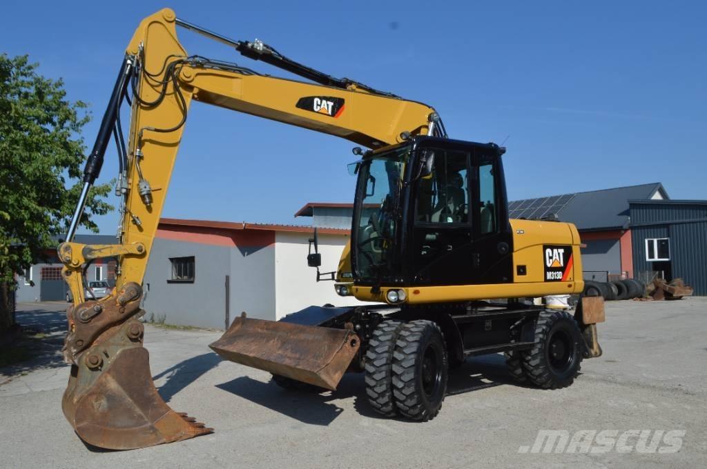 CAT M 313 D حفارات بعجل