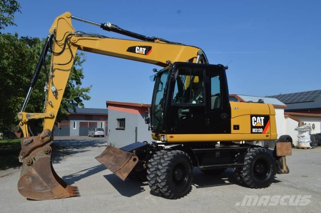CAT M 313 D حفارات بعجل