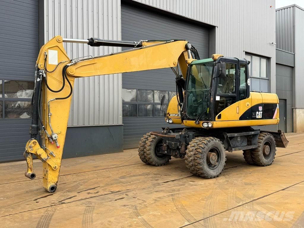 CAT M315D حفارات بعجل