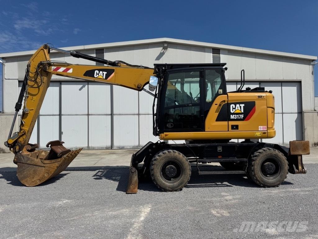 CAT M317F حفارات بعجل