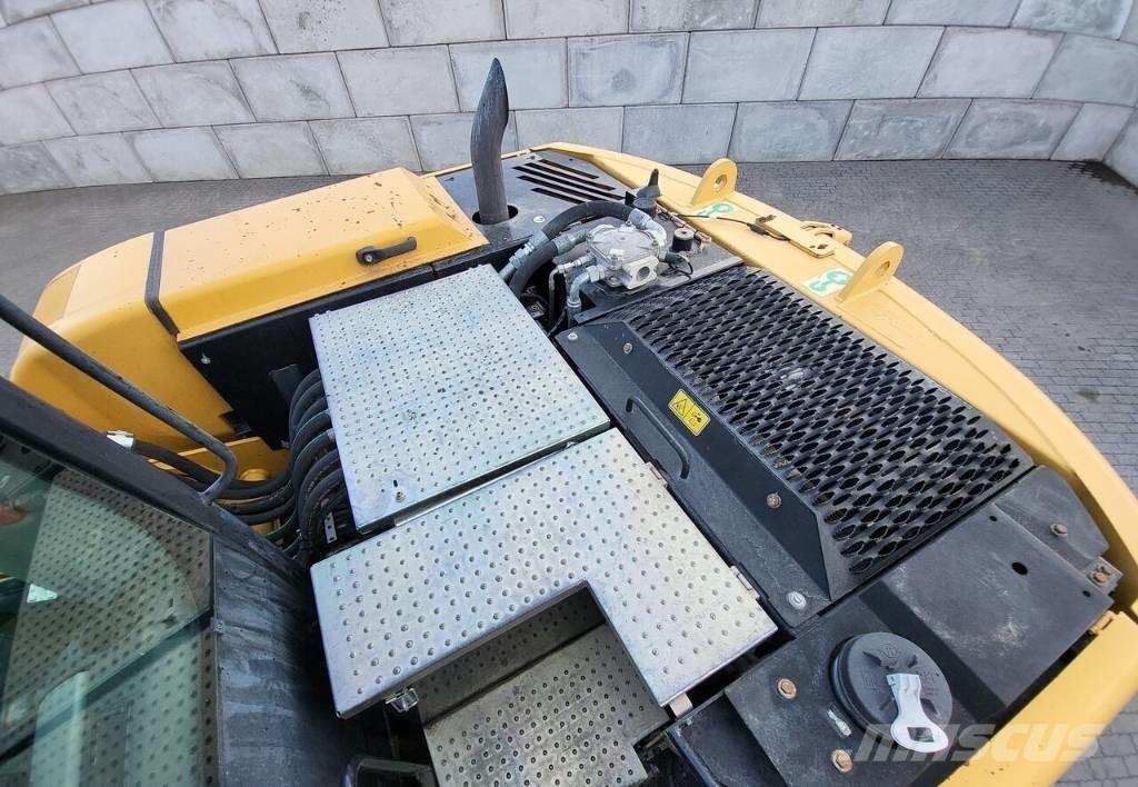 CAT M313 D حفارات بعجل