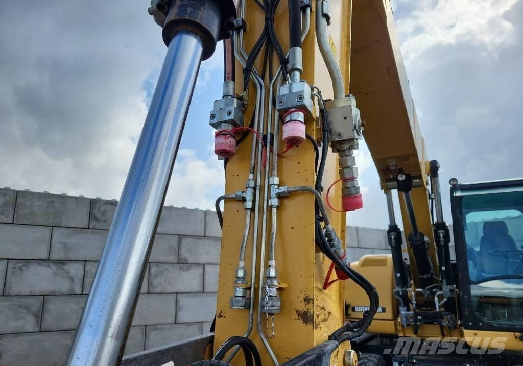 CAT M313 D حفارات بعجل