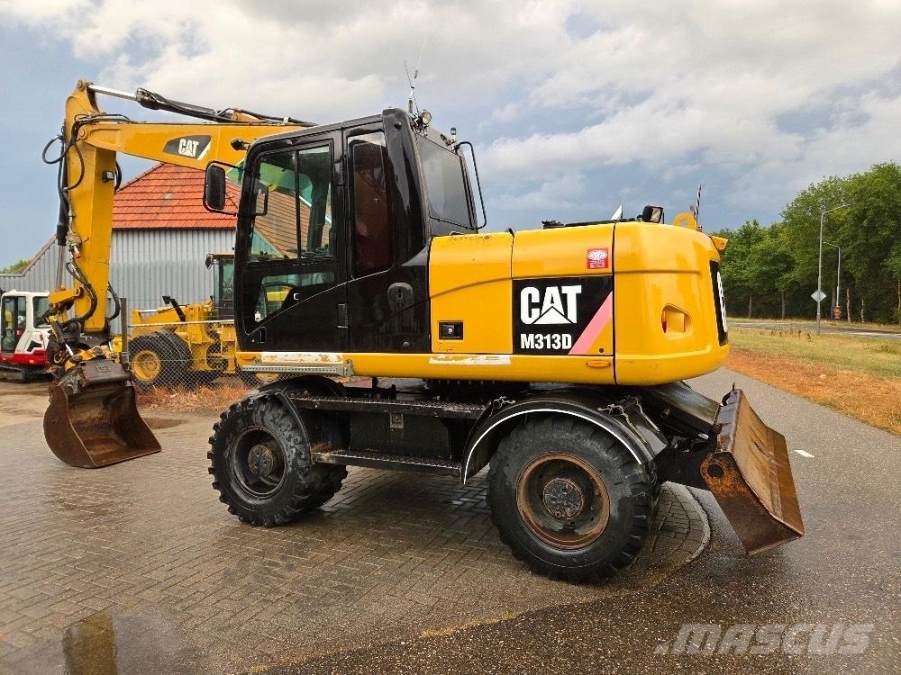 CAT M313D حفارات بعجل