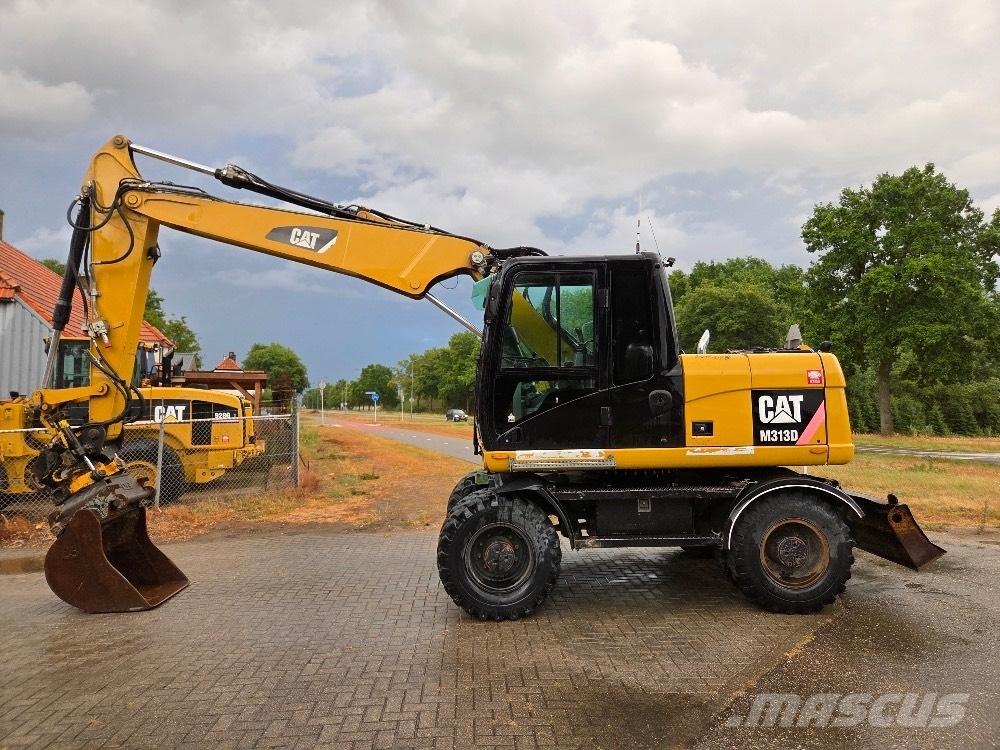 CAT M313D حفارات بعجل