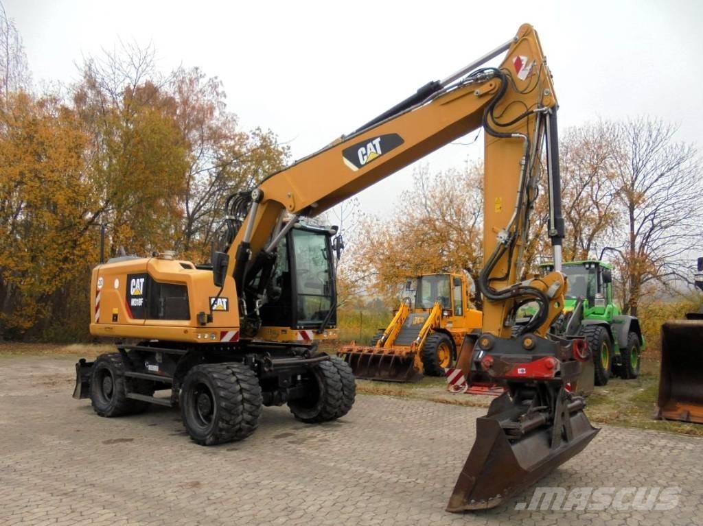 CAT M 318 F حفارات بعجل