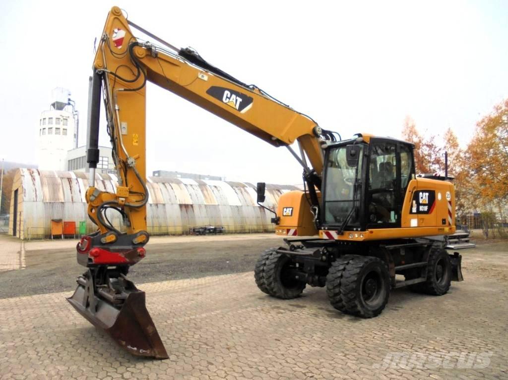CAT M 318 F حفارات بعجل