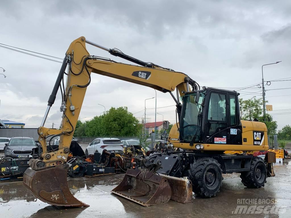 CAT M 313 D حفارات بعجل