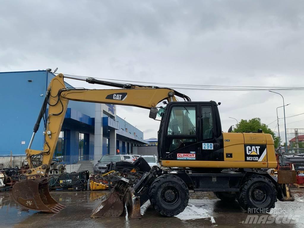 CAT M 313 D حفارات بعجل