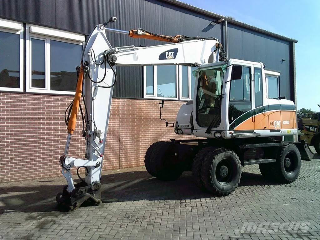 CAT M313D حفارات بعجل