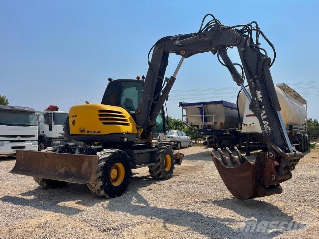 Mecalac 714 MW حفارات بعجل