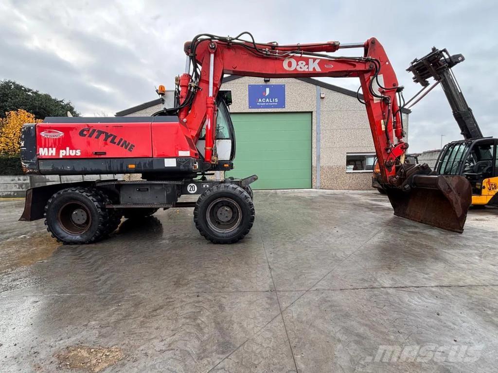 O&K MH PLUS حفارات بعجل