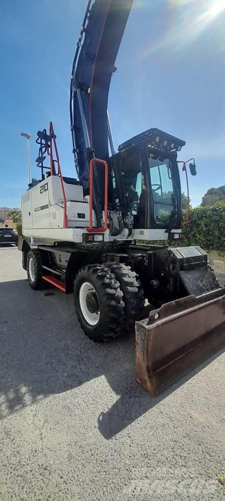 Hidromek HMK 210 W حفارات بعجل