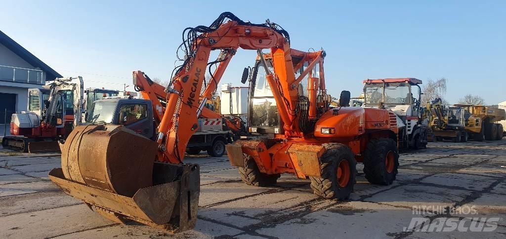 Mecalac 12 M TX حفارات بعجل