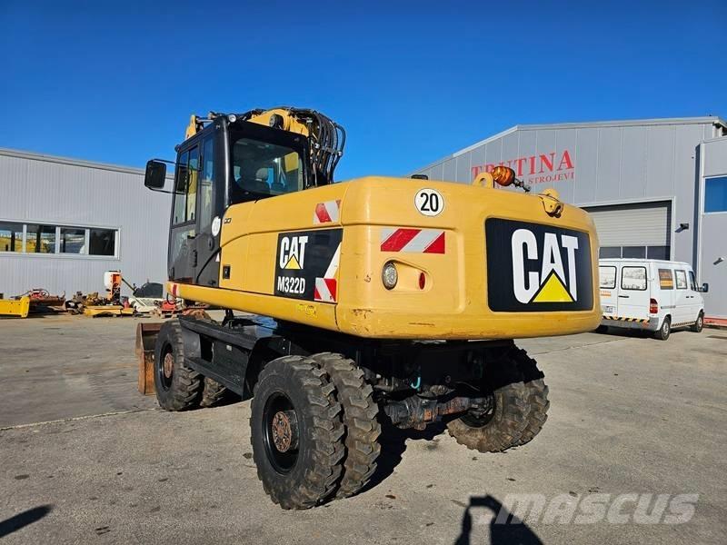 CAT M 322 D حفارات بعجل