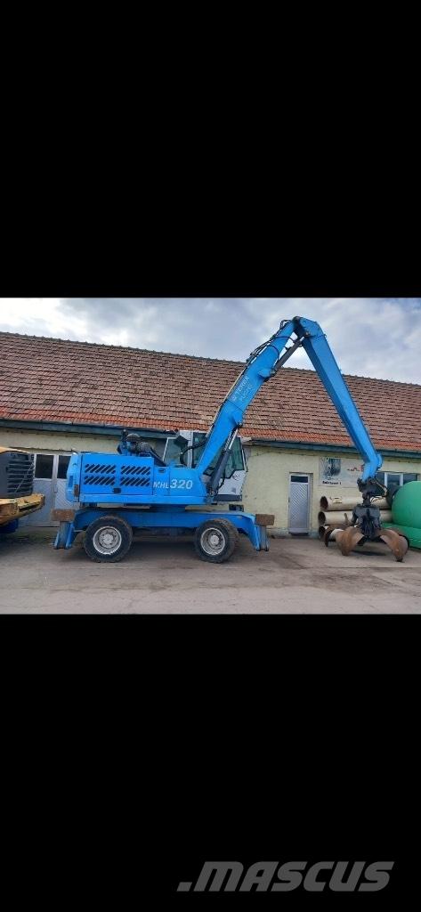 Fuchs MHL 320 حفارات بعجل