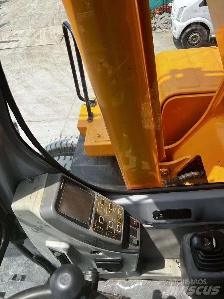 Hyundai 210W-7 حفارات بعجل