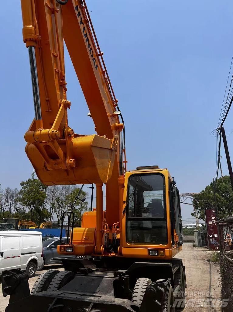 Hyundai 210W-7 حفارات بعجل