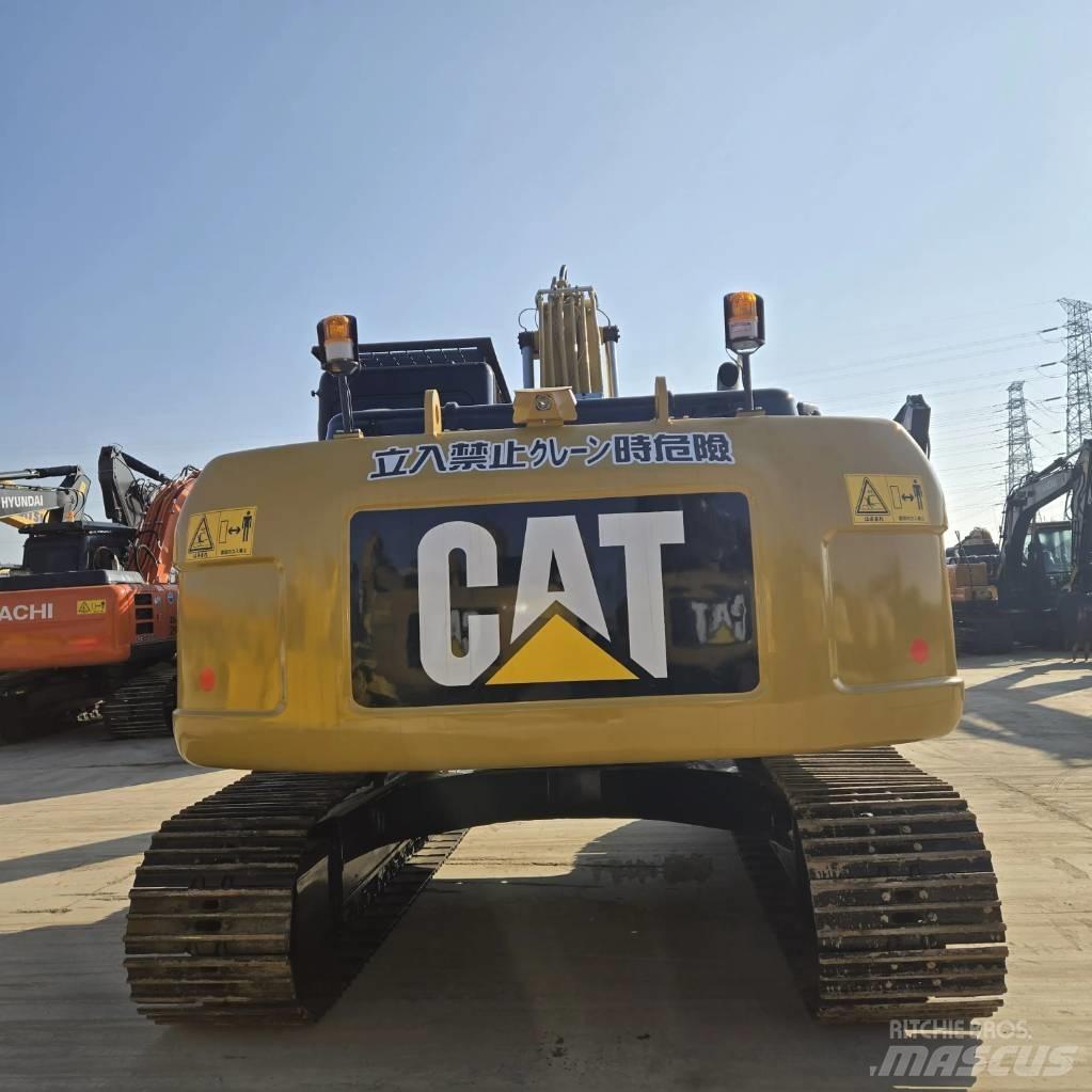CAT 323 D L حفارات وسط 7 طن - 12 طن