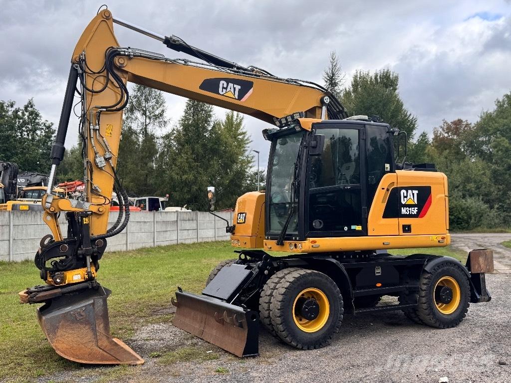 CAT M315F حفارات بعجل