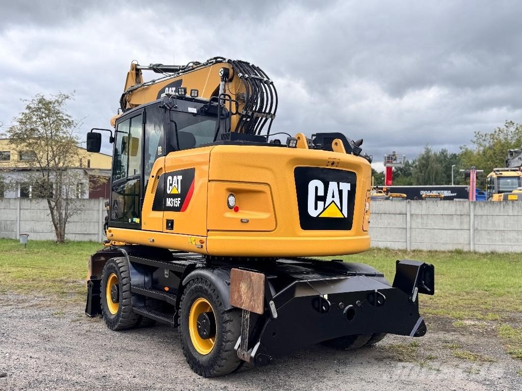 CAT M315F حفارات بعجل