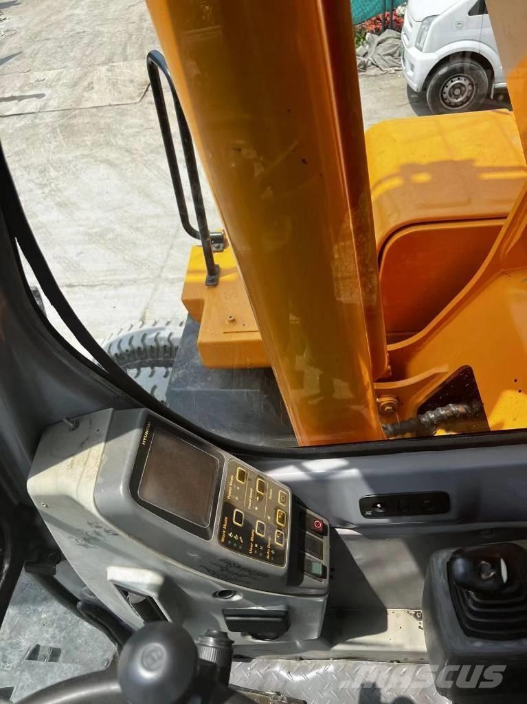 Hyundai 210W-7 حفارات بعجل