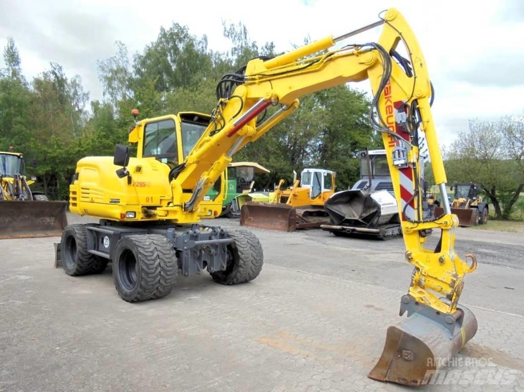 Takeuchi TB 295 W-2 حفارات بعجل