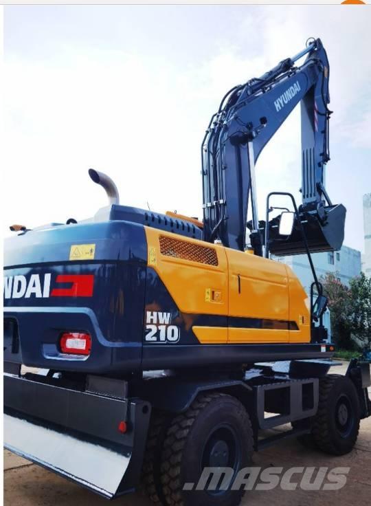 Hyundai 210 W-9 حفارات بعجل