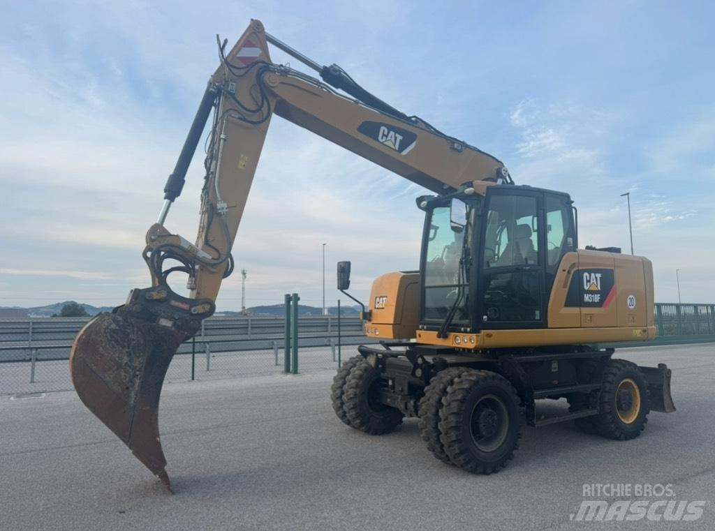 CAT M 318 F حفارات بعجل