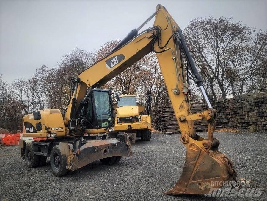 CAT M 315 D حفارات بعجل