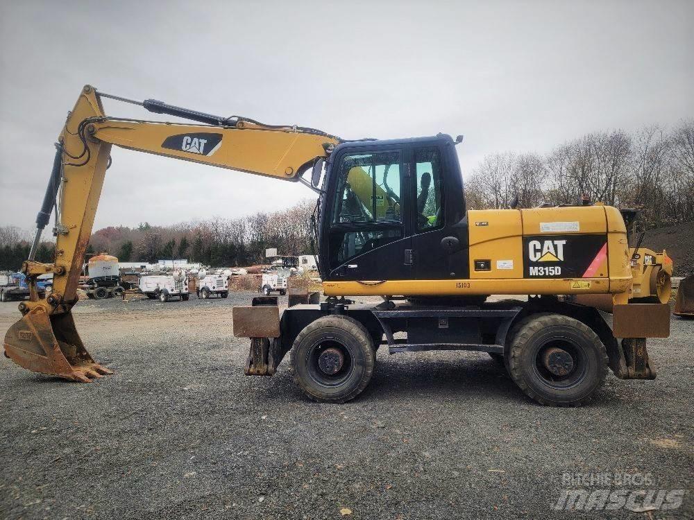 CAT M 315 D حفارات بعجل
