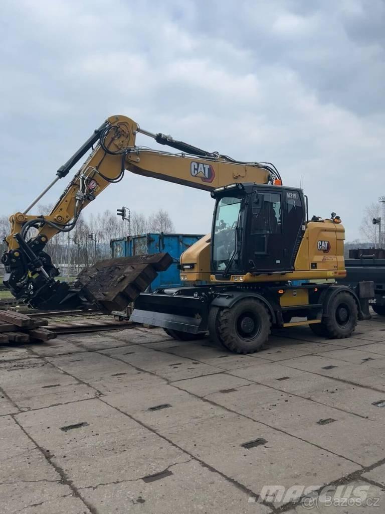 CAT M 319 حفارات بعجل