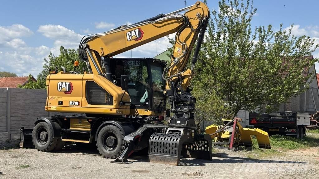 CAT M 319 حفارات بعجل