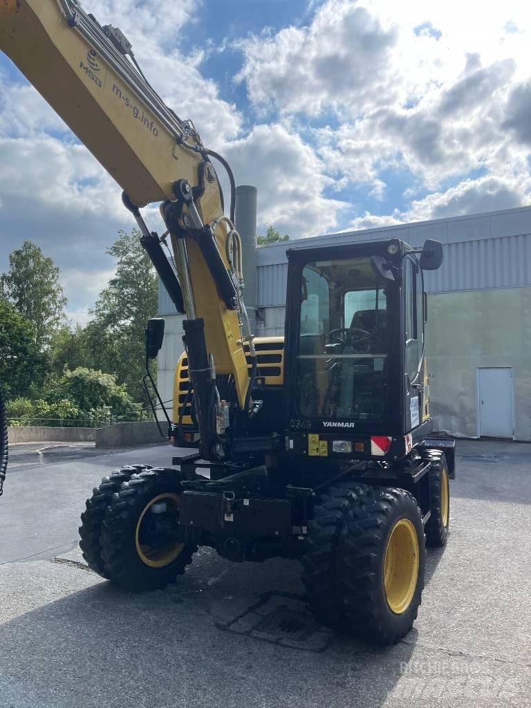 Yanmar B 95 W حفارات بعجل