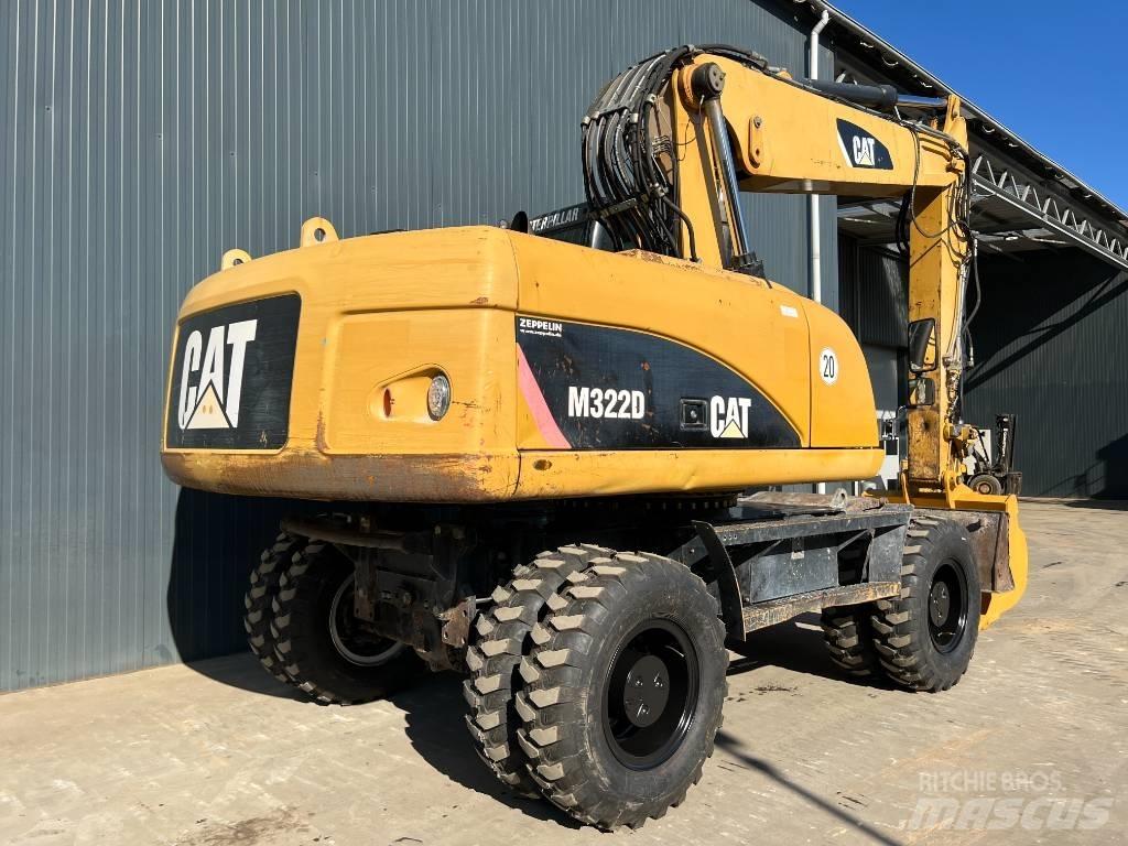 CAT M322D حفارات بعجل