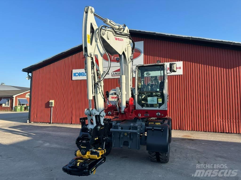 Takeuchi TB 395 W حفارات بعجل