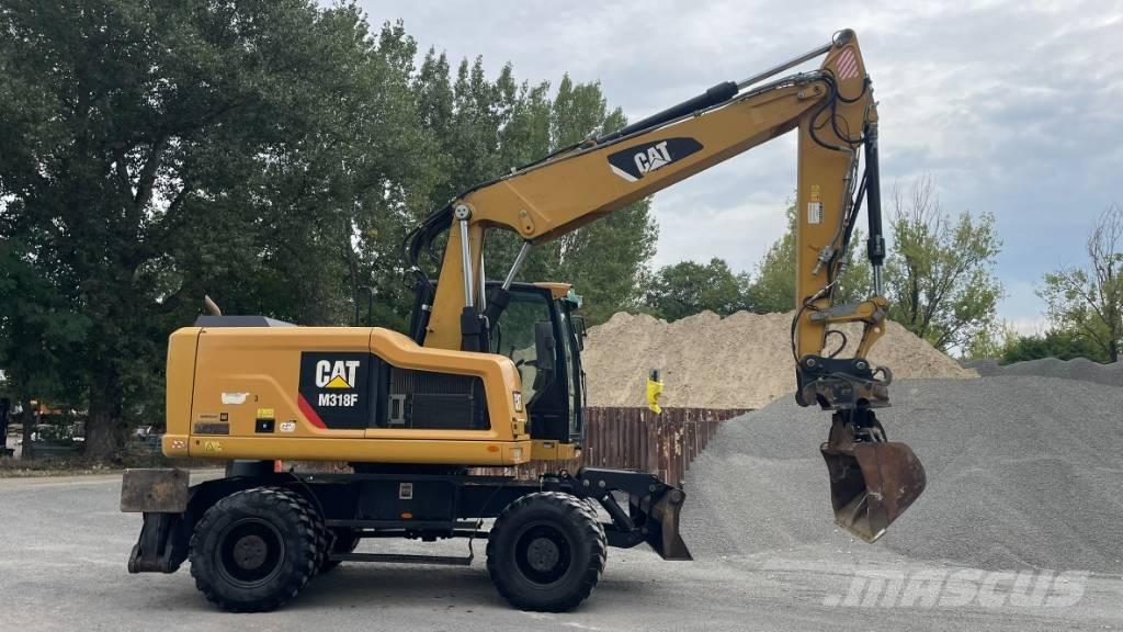 CAT M 318 F لوادر ذات جرافات عكسية
