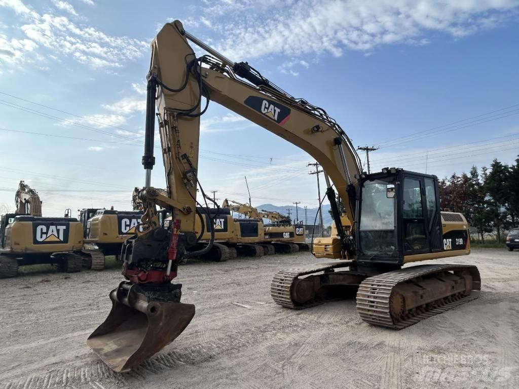 CAT 319 D L حفارات زحافة
