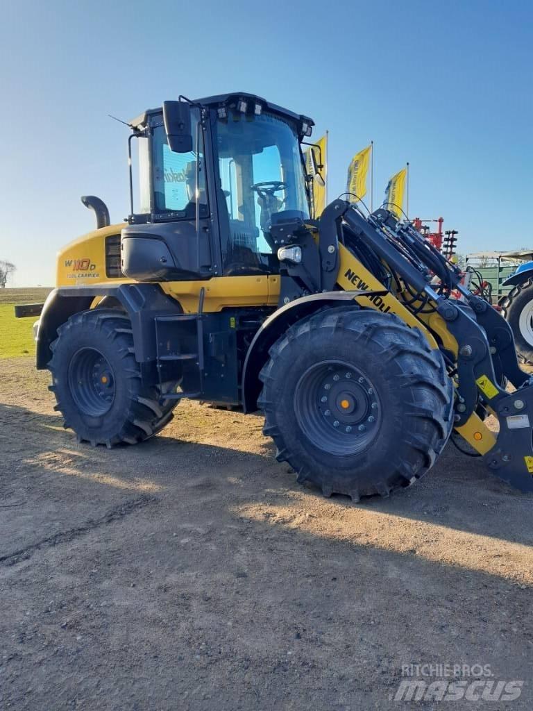 New Holland W 110 لوادر بعجل