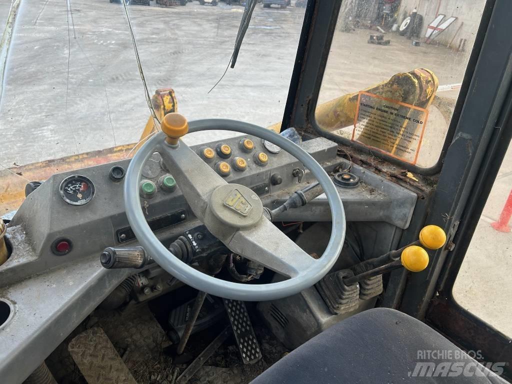 JCB 410 لوادر بعجل