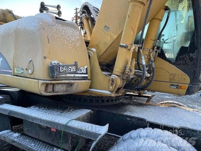 CAT M 322 C MH حفارات بعجل