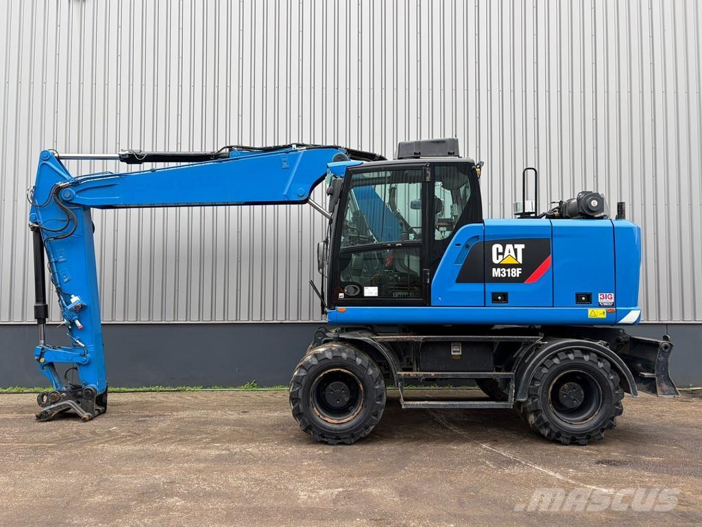 CAT M318F حفارات بعجل