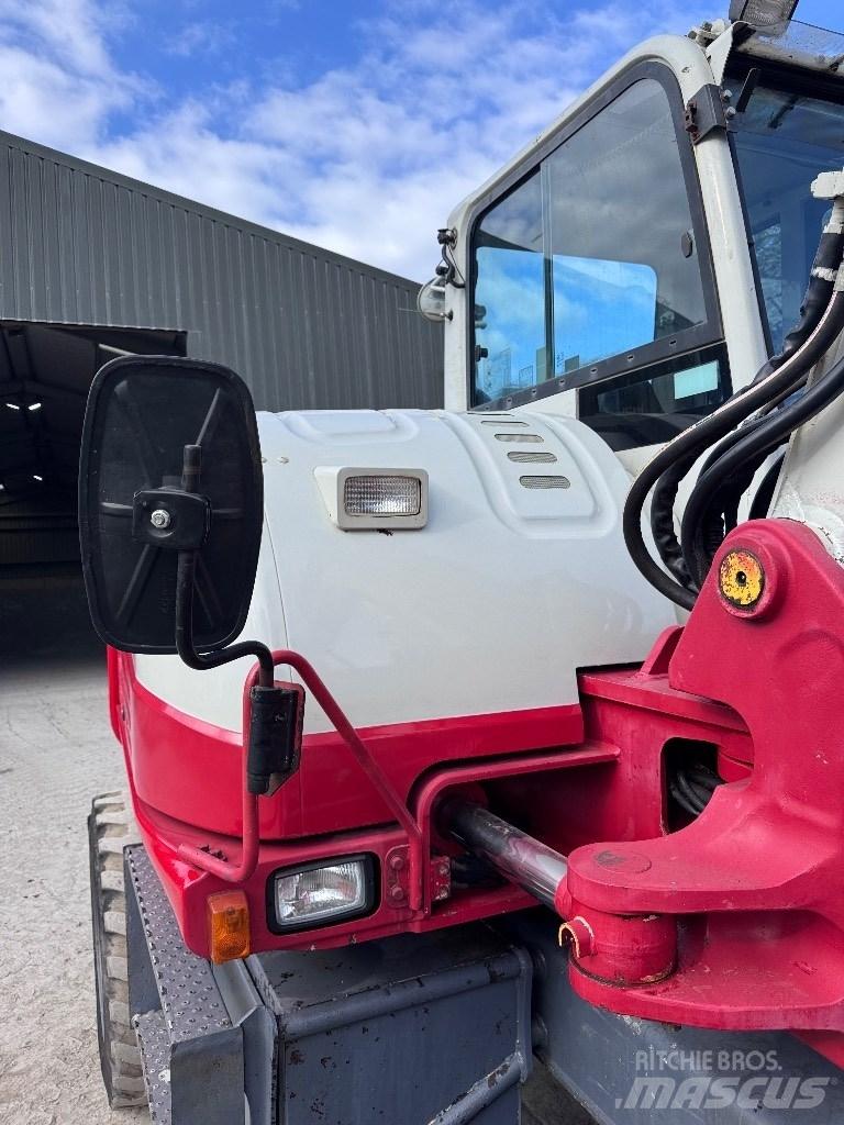 Takeuchi TB 295 W حفارات بعجل