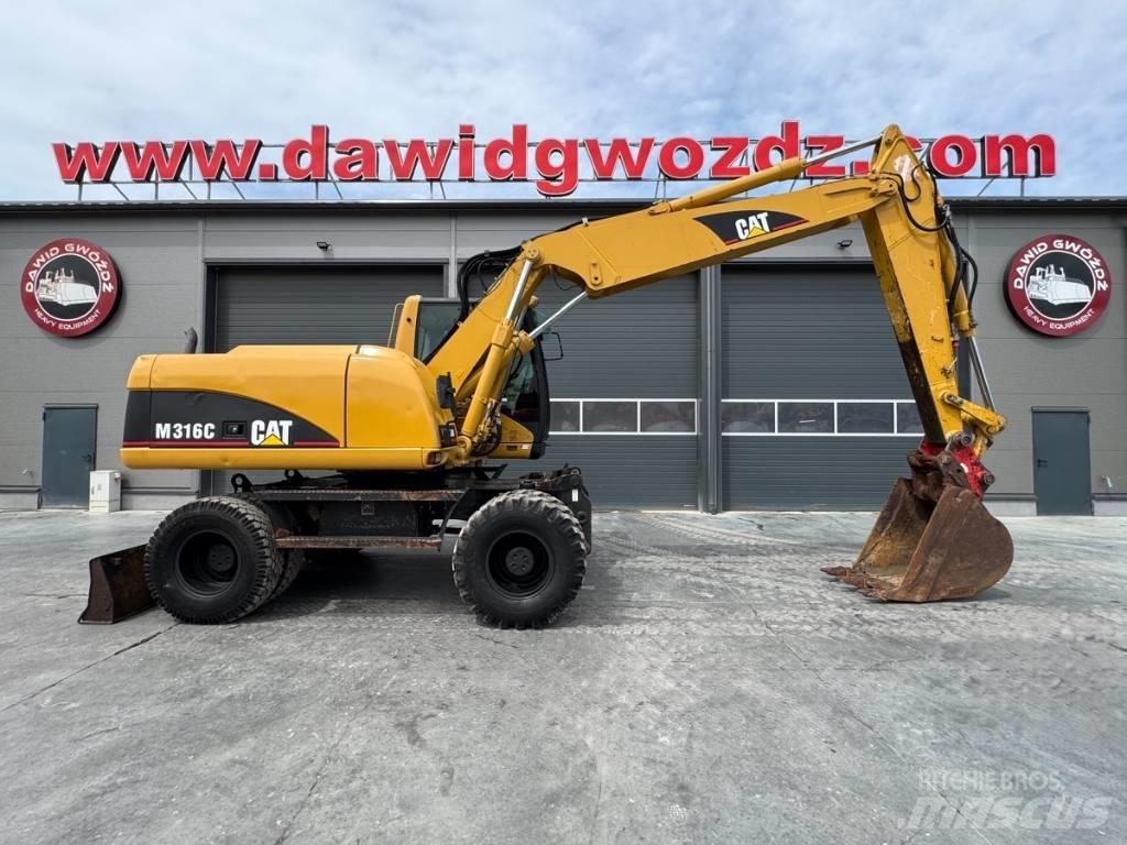 CAT M 316 C حفارات بعجل