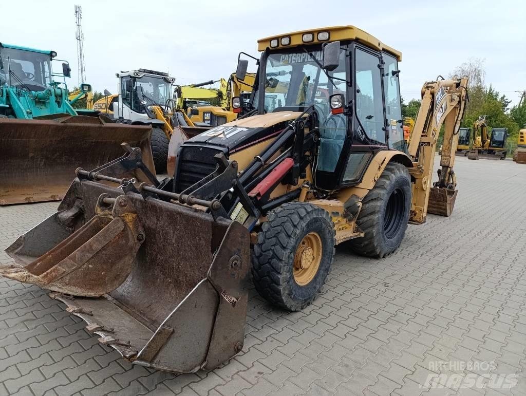 CAT 428 D لوادر ذات جرافات عكسية